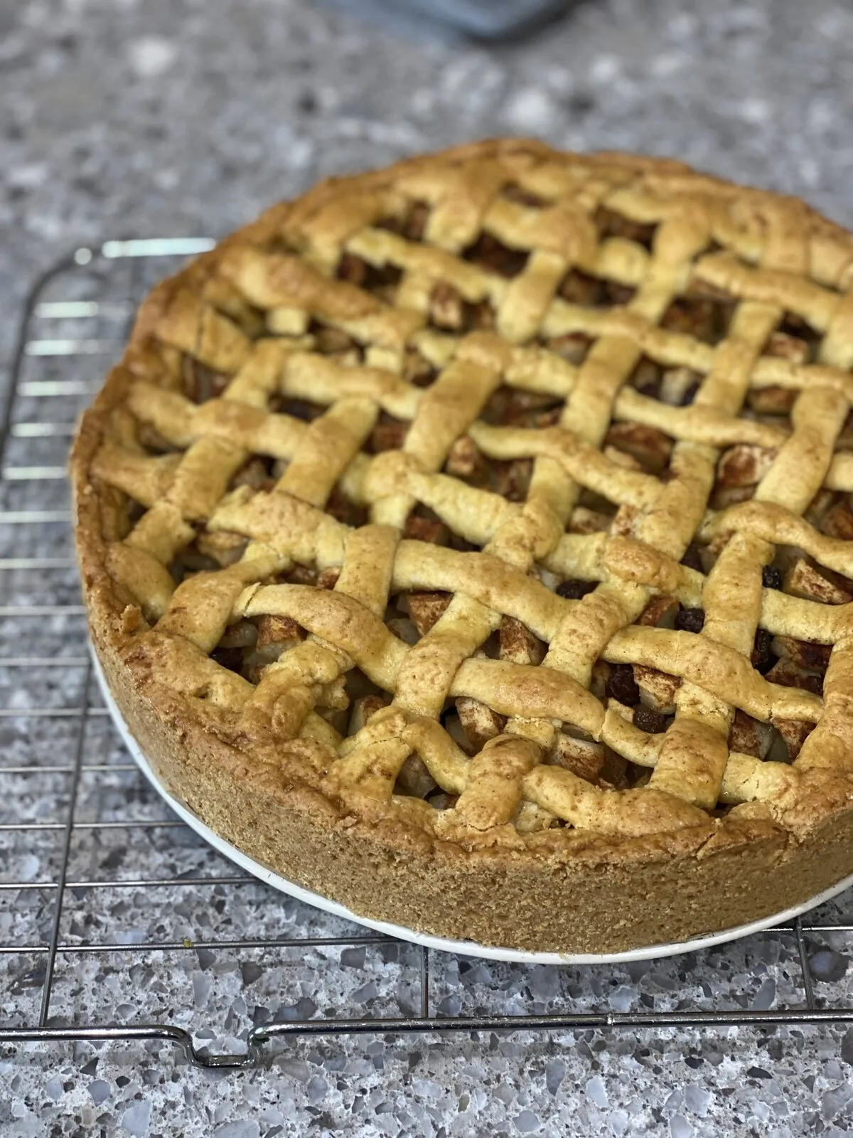 Apple tart cooling on a rack