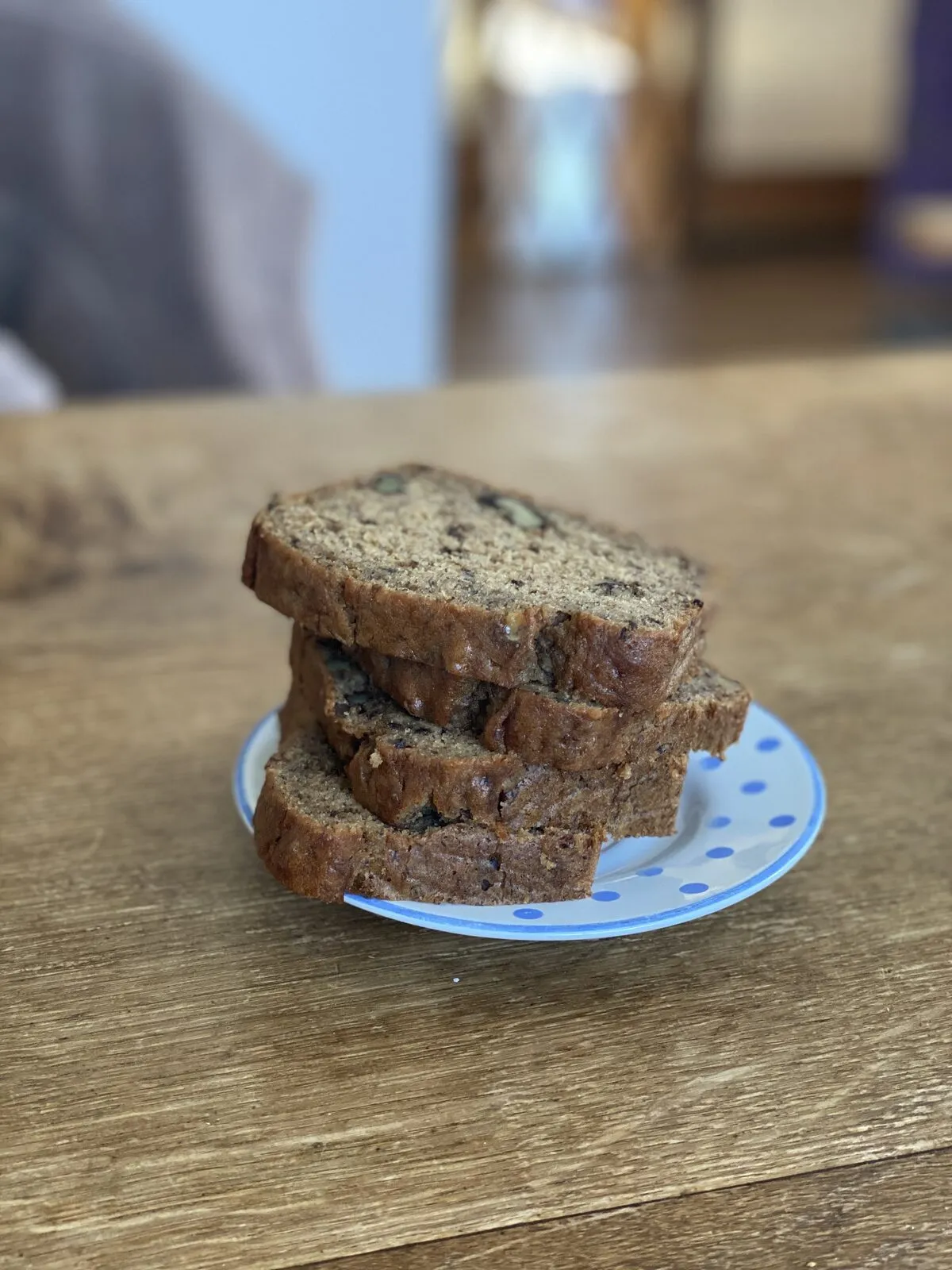 A sliced loaf of banana bread, served