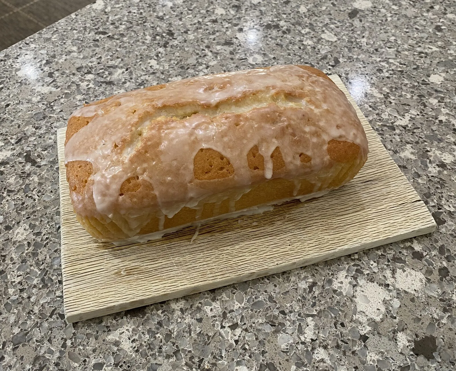 Lemon drizzle cake on a board
